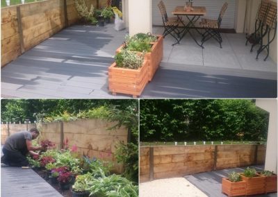 Création complète d'un jardin avec terrasse composite, muret de soutènement en poutre chêne, allée en grvier et dalles sur plots.
