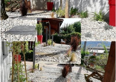 Massif avec pierre de schiste, graminées, lavandes, et pots de couleur